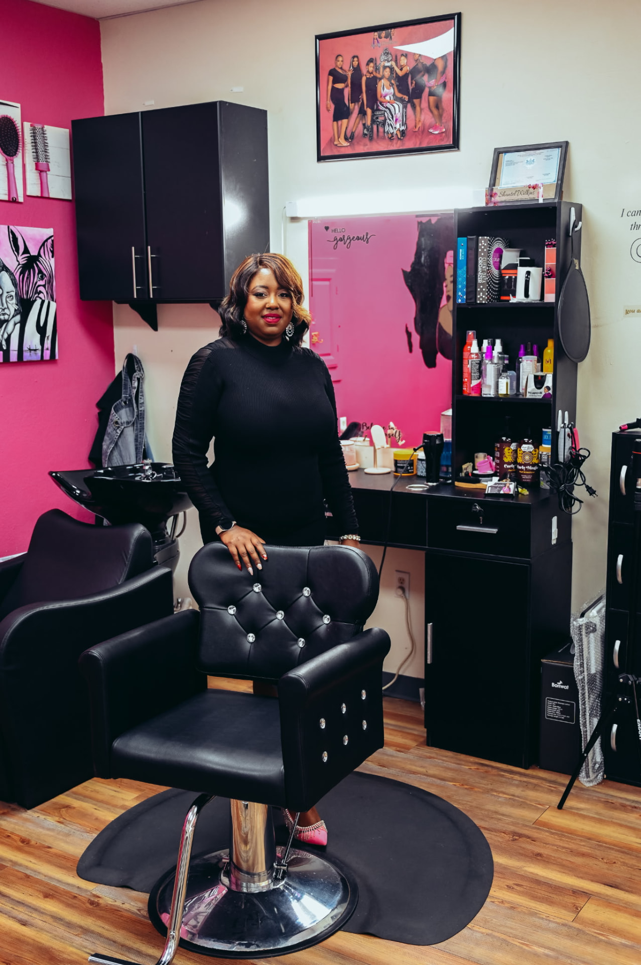 Shantel standing beside a styling chair in her salon